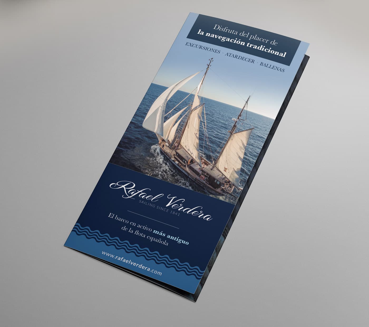Cover of the trifold with the wooden sailboat under sail next to the Rafael Verdera logotype