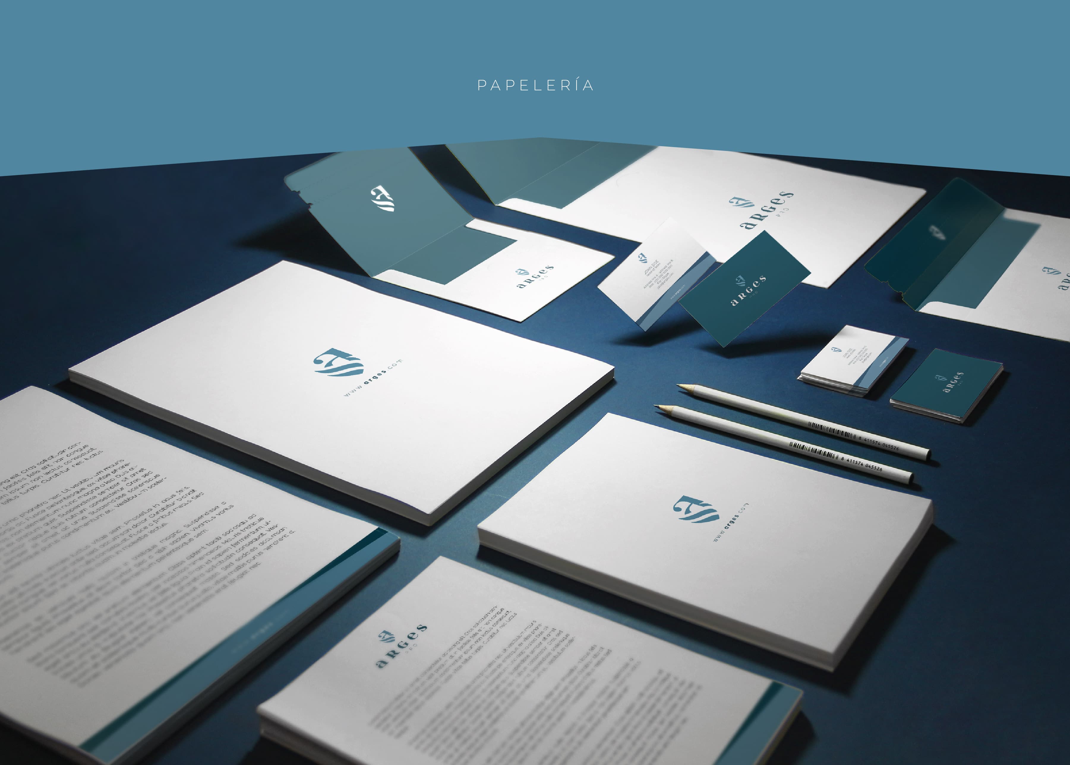 Arges Pro corporate stationery with folders, business cards and envelopes on a blue background