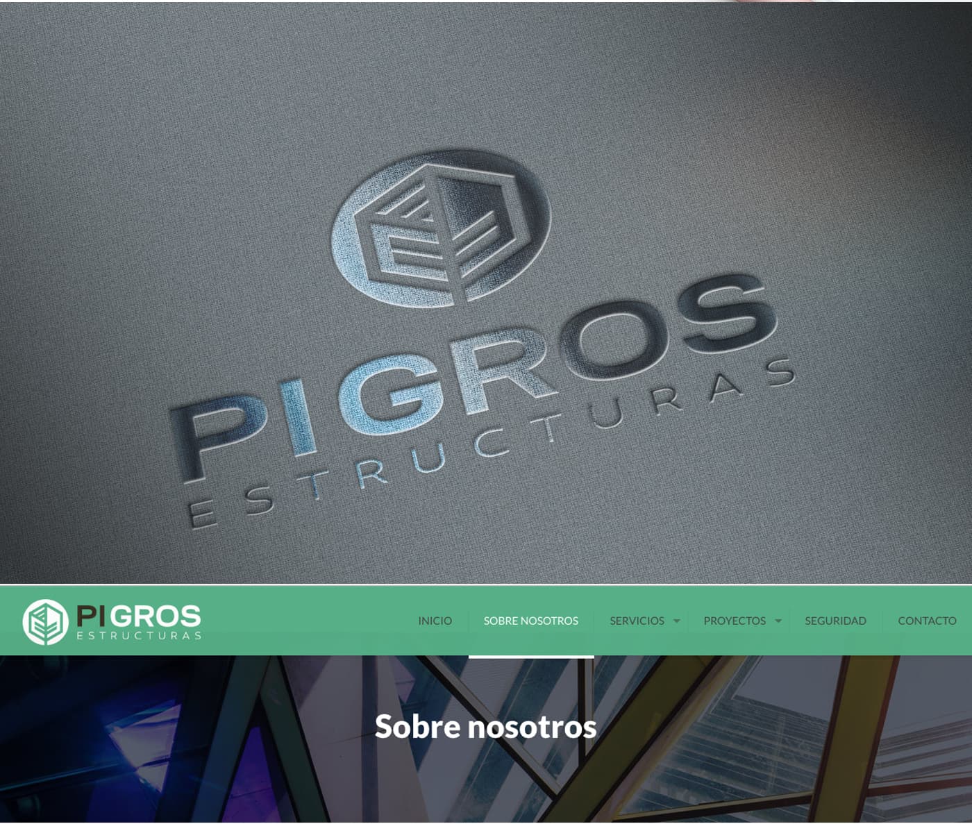 Logotip de Pi Gros en relleu sobre roba grisa al costat del menú de navegació de la web