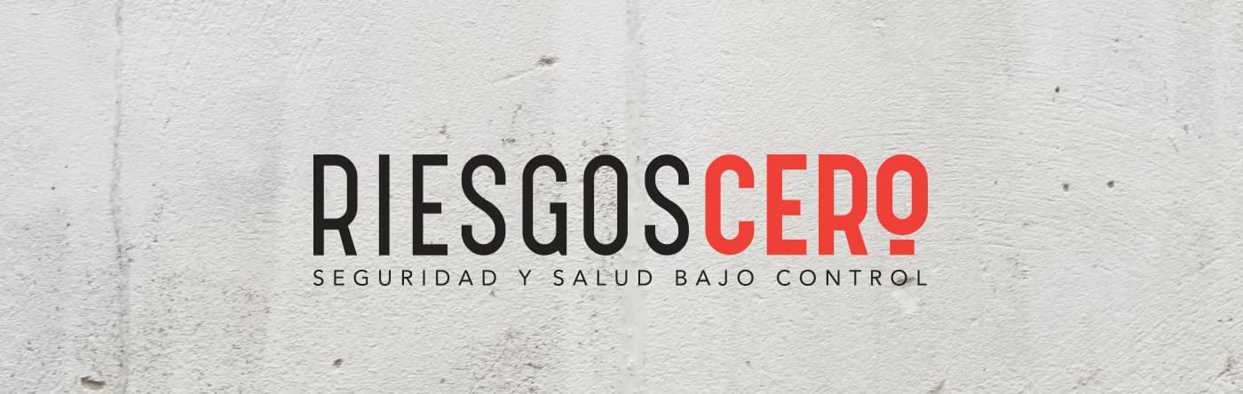 Riesgos Cero logo in black and red on a concrete wall texture
