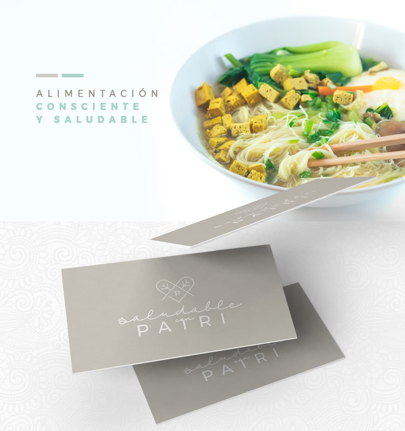 Grey business cards next to a bowl of noodles with vegetables and egg