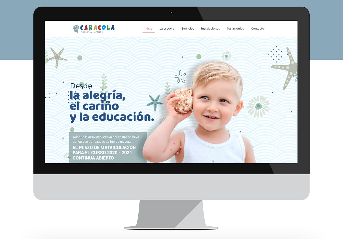 iMac mockup of the homepage with a child and a seashell against a marine background