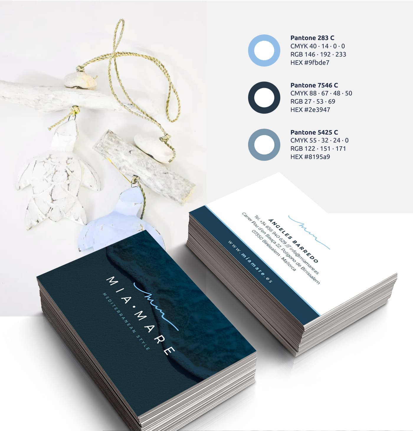Business cards with a beach photo and a blue Pantone colour palette