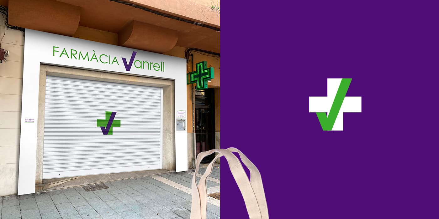 Storefront with the Farmàcia Vanrell sign and symbol on the shutter