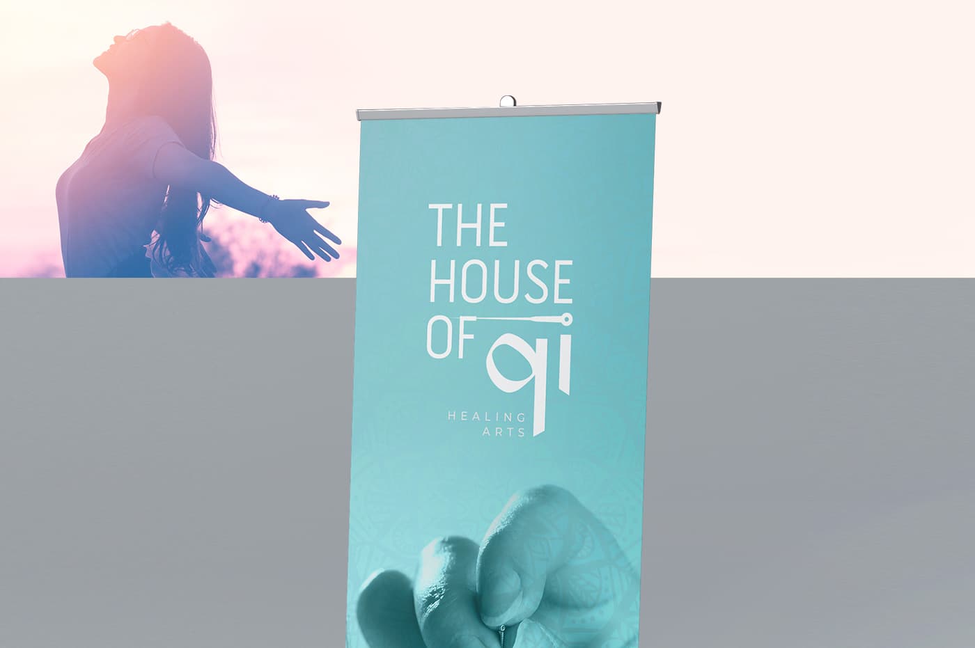 Turquoise advertising roll-up mockup with the logotype and a female silhouette