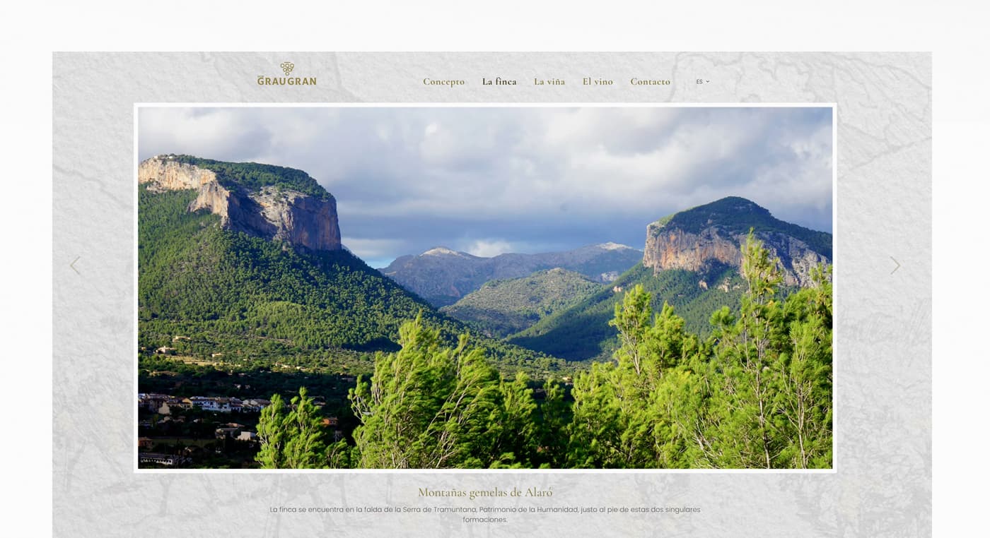 Website section with a panoramic photograph of Alaró's twin peaks