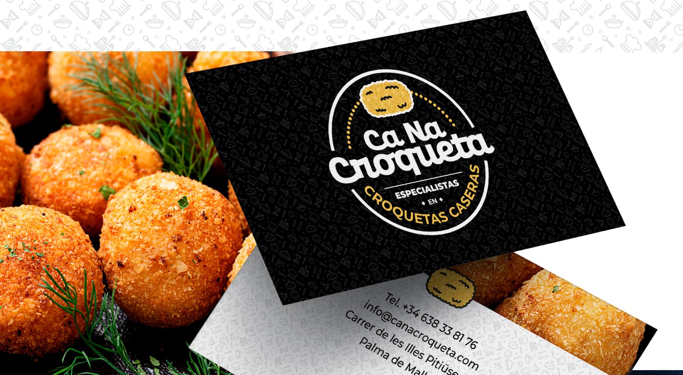 Targetes de visita en negre amb el logotip i croquetes daurades de fons