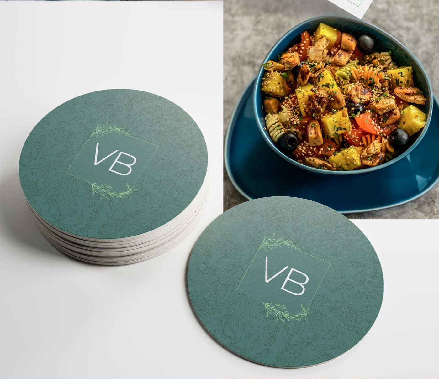 Round coasters with the VB monogram next to a bowl of pasta with vegetables