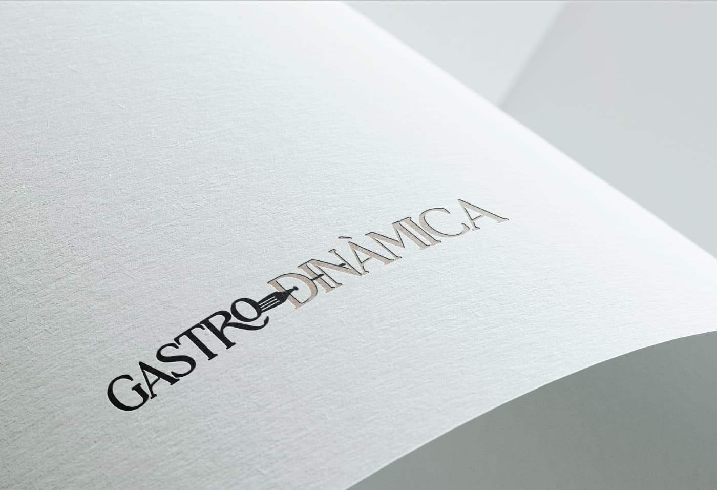 Gastrodinàmica logo embossed on textured paper