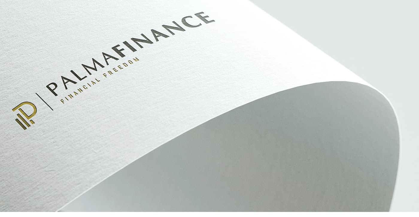 Macro detail of the embossed logo next to the tagline Financial Freedom