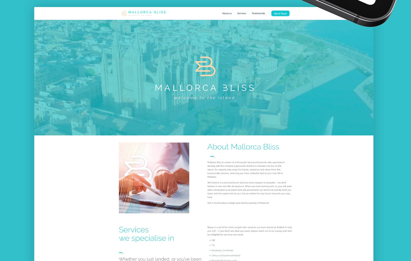 Laptop mockup with the homepage and a photo of Palma Cathedral