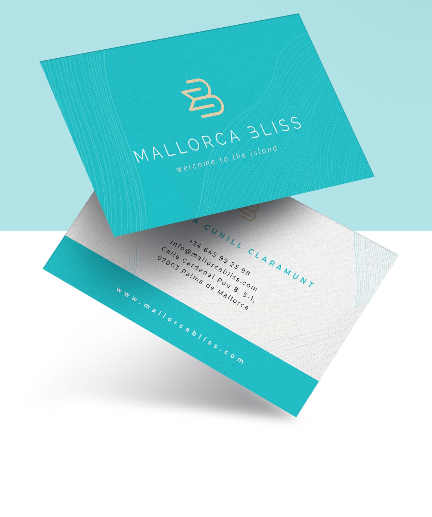 Turquoise business cards with the gold logo and contact details