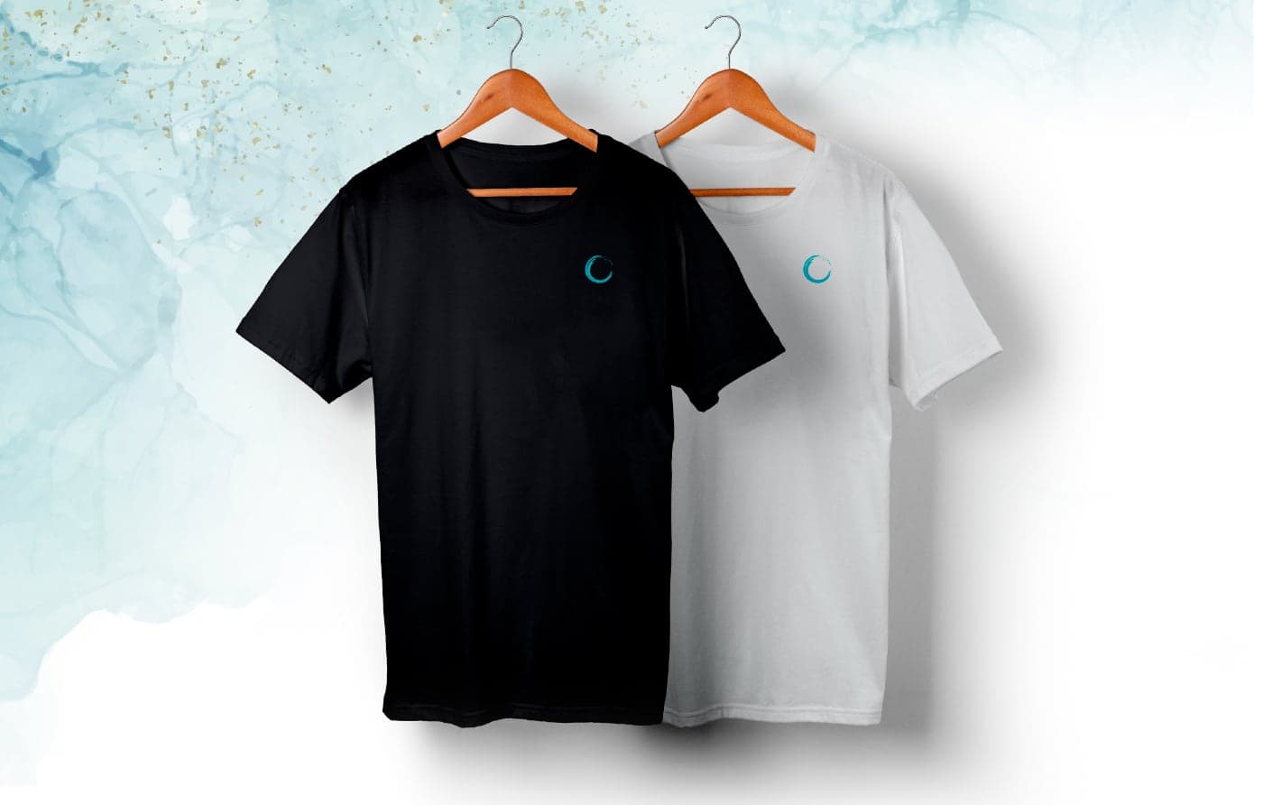 Black and white T-shirts with the logo embroidered in turquoise