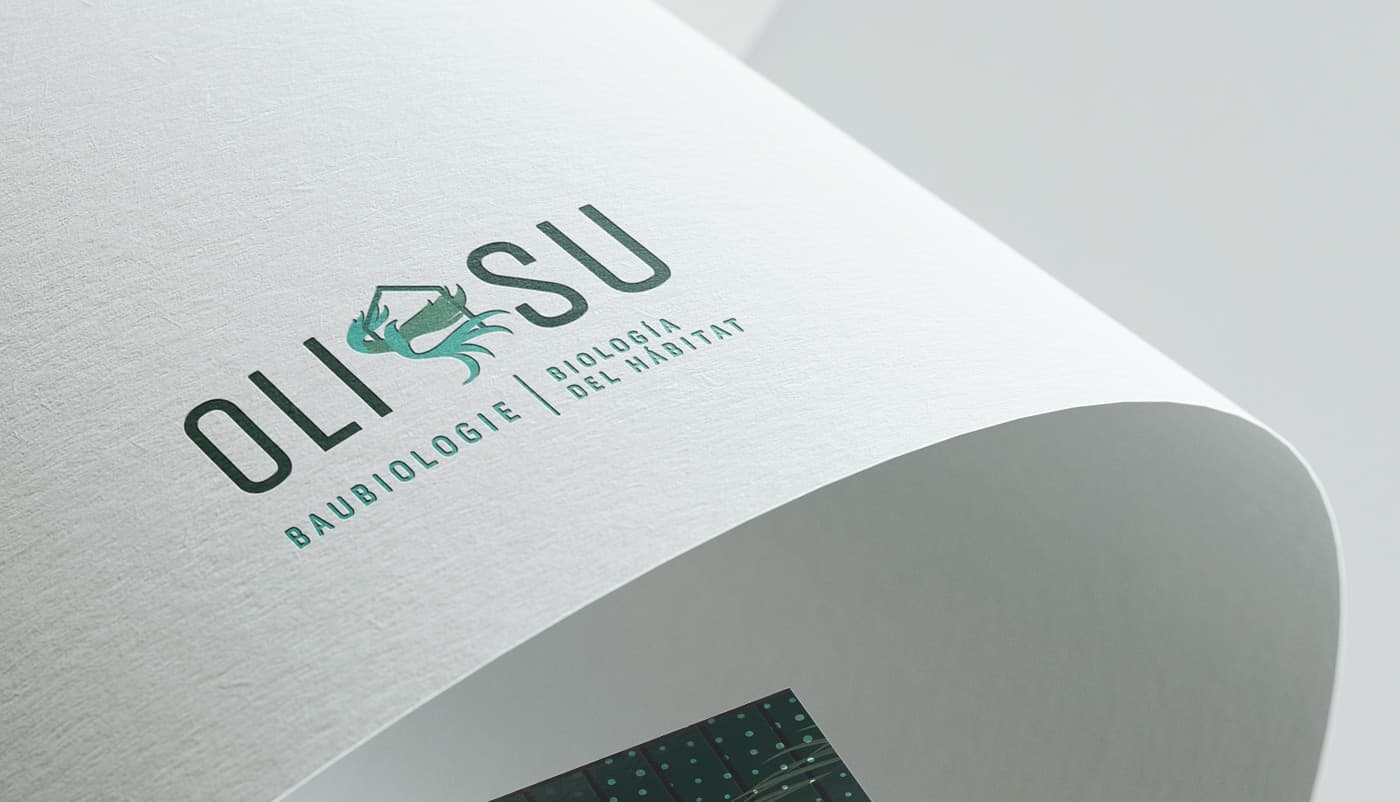 Detail of the Oli-Su logo embossed on textured paper
