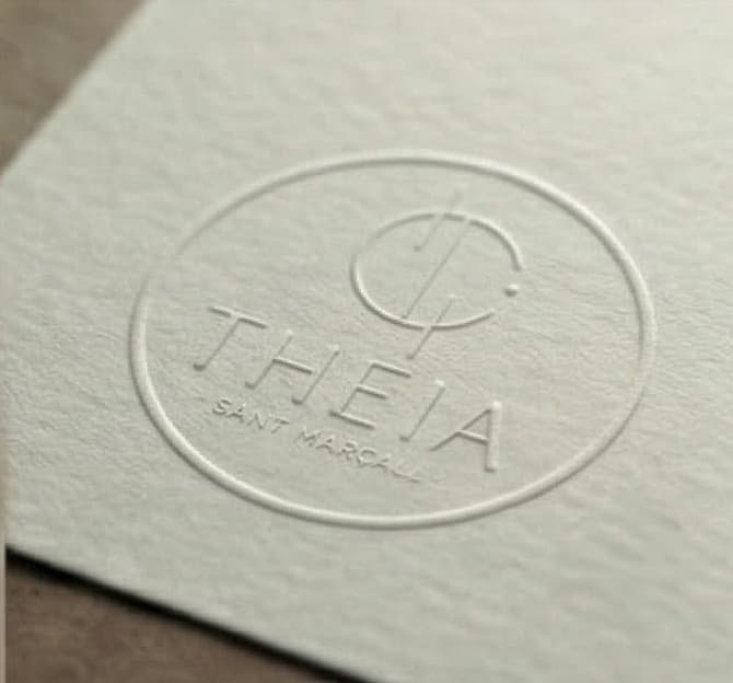Detail of the Theia logotype in blind emboss on textured paper